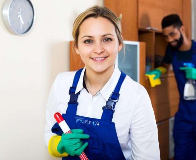 Cheerful young cleaners cleaning and dusting in ordinary house